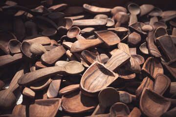 wooden spoons for sale at a weekly market