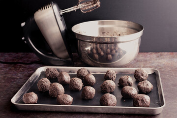 Uncoated Cookies and Cream Truffles on a Sheet Pan: Chocolate  cream cheese truffle fillings with a...