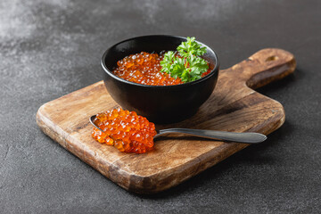 Red salmon caviar with parsley in a bowl