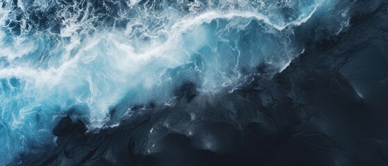 Black sand with blue ocean clear water , aeriel view ,dark atmosphere   - obrazy, fototapety, plakaty