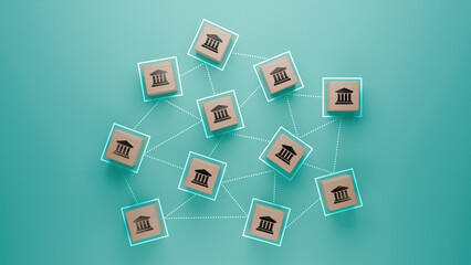 Array of connected banks illustrated with wooden blocks on teal background, financial institutions...