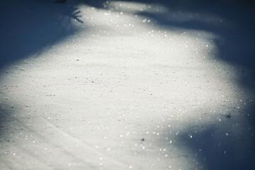 Snow cover, close-up, selective focus, shimmering with different colors in the sun. sparkling snow...