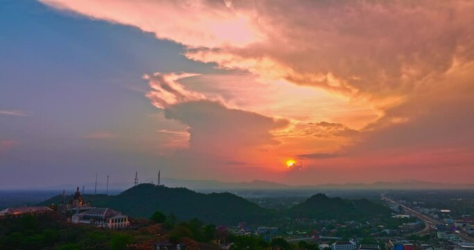.Aerial view Huge, brightly colored clouds curled into a spiral above the castle..amazing cloud in bright sky at sunset above the palace on hilltop.Phetchaburi city background. cityscape background