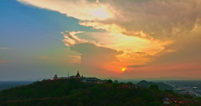 .Aerial view Huge, brightly colored clouds curled into a spiral above the castle..amazing cloud in bright sky at sunset above the palace on hilltop.Phetchaburi city background. cityscape background