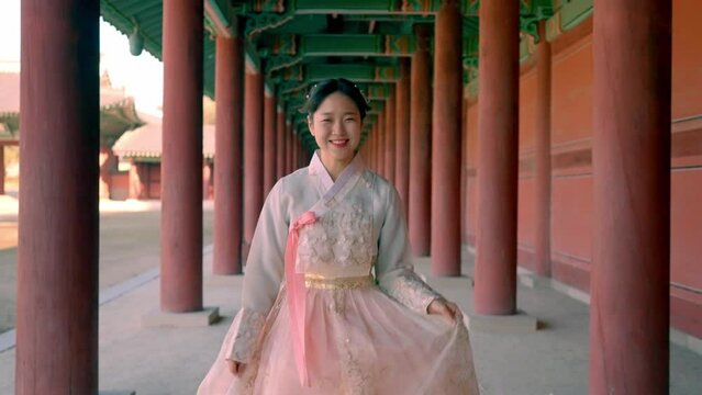 A graceful smile in traditional Hanbok at Changdeokgung palace, capturing the beauty of Korean culture