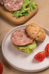 Sandwich with sausage and lettuce
