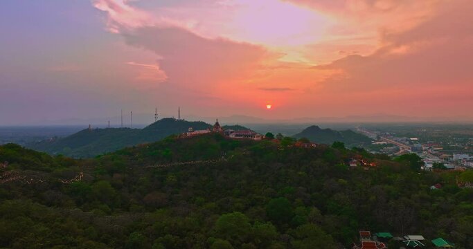 .Aerial view Huge, brightly colored clouds curled into a spiral above the castle..amazing cloud in bright sky at sunset above the palace on hilltop.Phetchaburi city background. cityscape background