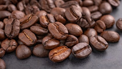 Freshly roasted coffee beans close up on a dark background