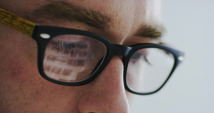 Man, glasses and screen reflection in closeup for reading, optometry and wellness for eyesight at job. Person, lens and frame for healthy eyes, ophthalmology and thinking with vision, ideas or search