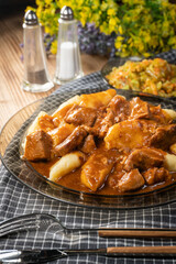 Beef stew in gravy, served with potato dumplings.