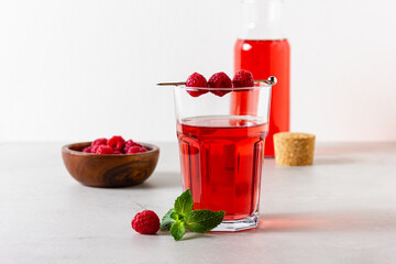 Raspberry drink in the glass with mint.