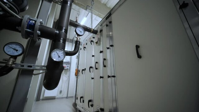 Industrial interior chiller and boiler HVAC heating ventilation air conditioning system and piping line of industrial construction at boiler pump room system in the factory