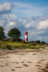 Lighthouse on the Baltic Sea with an overcast sky.