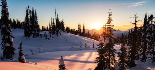 Winter Landscape in Canadian Mountain Landscape. Colorful Sunset.