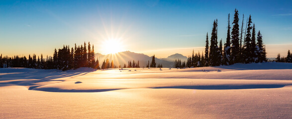 Winter Landscape in Canadian Mountain Landscape. Colorful Sunset.