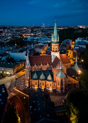 St Joseph church on Rynek Podgorski square, Krakow, Poland, aerial view in the night