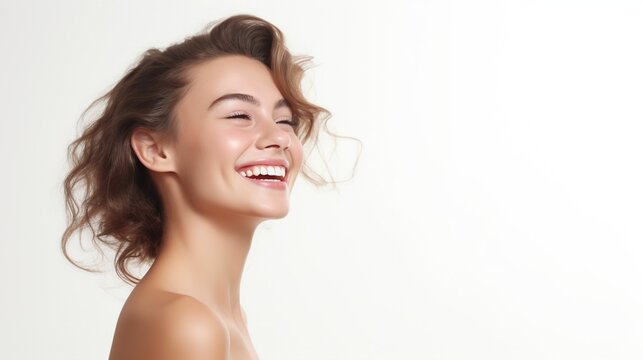 A Woman Smiling With Flawless Glowy Skin With Copy Space Isolated On The White Background
