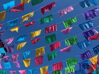Colorful Papel Picado flags/banners hanging in the streets of Oaxaca, Mexico