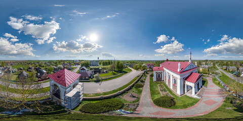 aerial full hdri 360 panorama  view on white baroque catholic church in countryside or village in...