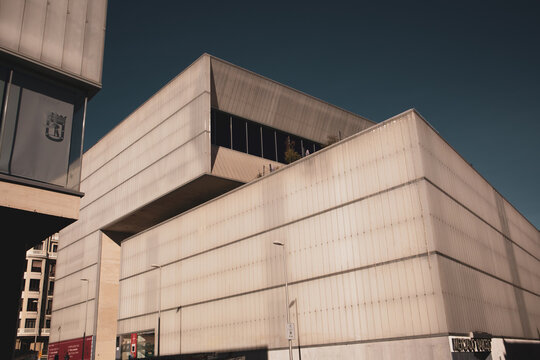 Madrid, Spain November 22, 2023 MERCADO BARCELO Huge gray steel building Centro Polivalente Barcelo multi-use center composed of market hall, sports center. Commercial building wall exterior.