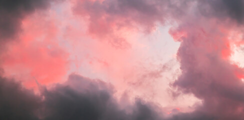 Pink sky with stormy clouds. Sunrise clouds are in vanilla colours. Beauty in nature. Details of...