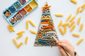Sensory creative activity for children, child coloring pasta