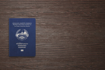 Laotian passports are issued to citizens of Laos, Laos passport on wooden background