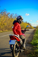 biker girl in red. red motorcycle.