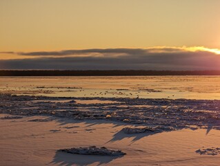 Hard frost. Sunset over the frozen river. High quality photo