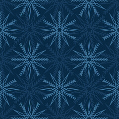 Seamless pattern of snowflakes on a dark blue background. For greeting card, banner, web, scrapbooking. Winter decoration.