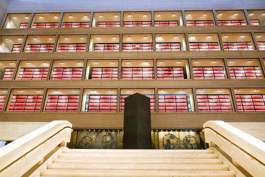 Lyndon Baines Johnson Library and Museum, Austin, Texas, USA: Looking up from main staircase into the four floors of archives, illuminated red boxes on shelves with presidential seal