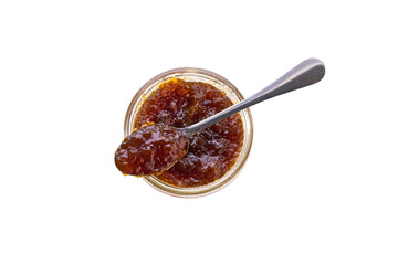 Top view of figs jam in jar with spoon isolated on white background.