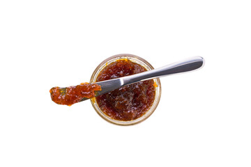 figs jam in jar with knife isolated on white background, top view.