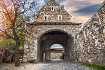 Stone tower of an ancient castle with a passage.