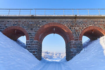 Transport hub. Winter viaduct made of brick and concrete