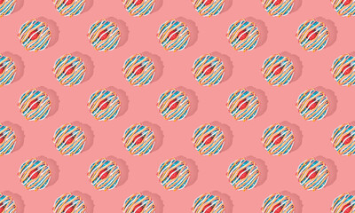Pattern of donuts on pink pastel background