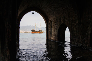 Inside the old shipyard of Alanya, Turkey. In the background there is an old pirate ship.