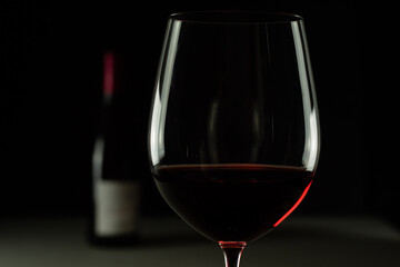 Red wine in a cup with black background