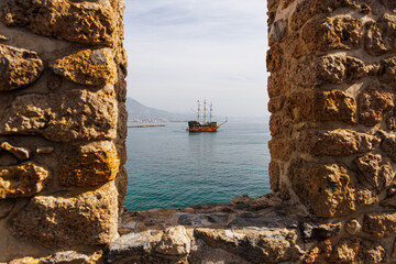 View of a Turkish pirate old ship through the fortress wall