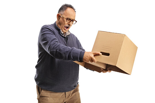 Surprised mature man holding an empty cardboard box