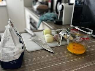 Preparation of Thanksgiving Dinner at home. The smell of cut garlic, onion, melted butter, rosemary, sage, and thyme