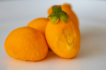 Typical ripe pequi fruit (caryocar brasiliense) in fine details and selective focus. Typical fruit from the Brazilian cerrado bioama.