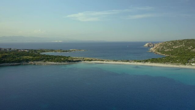 Drone aerial view of Rena di Ponente turquoise water beach in Capo Testa cape in Sardinia, Italy