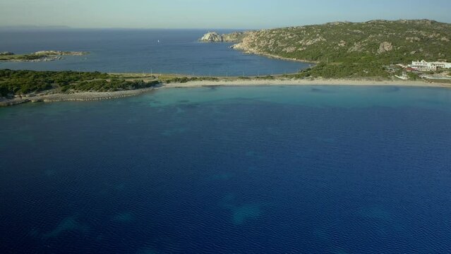 Drone aerial view of Rena di Ponente turquoise water beach in Capo Testa cape in Sardinia, Italy