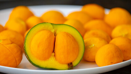 Typical ripe pequi fruit (caryocar brasiliense) in fine details and selective focus. Typical fruit from the Brazilian cerrado bioama.