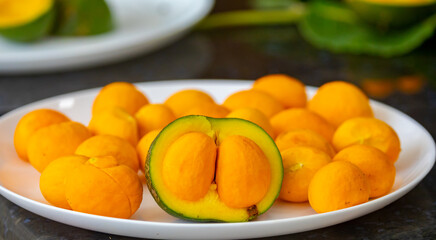 Typical ripe pequi fruit (caryocar brasiliense) in fine details and selective focus. Typical fruit...