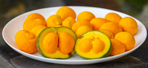 Typical ripe pequi fruit (caryocar brasiliense) in fine details and selective focus. Typical fruit from the Brazilian cerrado bioama.