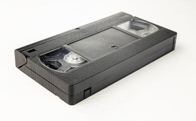 An old VHS videotape on a white background, top view.