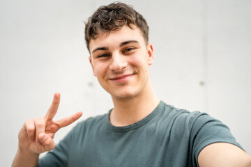 portrait of young Caucasian man teenager 18 or 19 years old outdoor