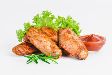 Chicken wings fried until half cooked, semi-finished product with fresh herbs on a white background. Fast food. Fast cooking.Quick cooking at home. Copy space.Fast homemade food.Raw chicken meat.